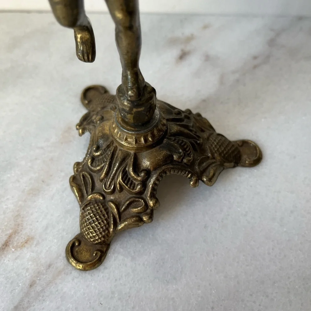 Antique cherub figurine candle holder